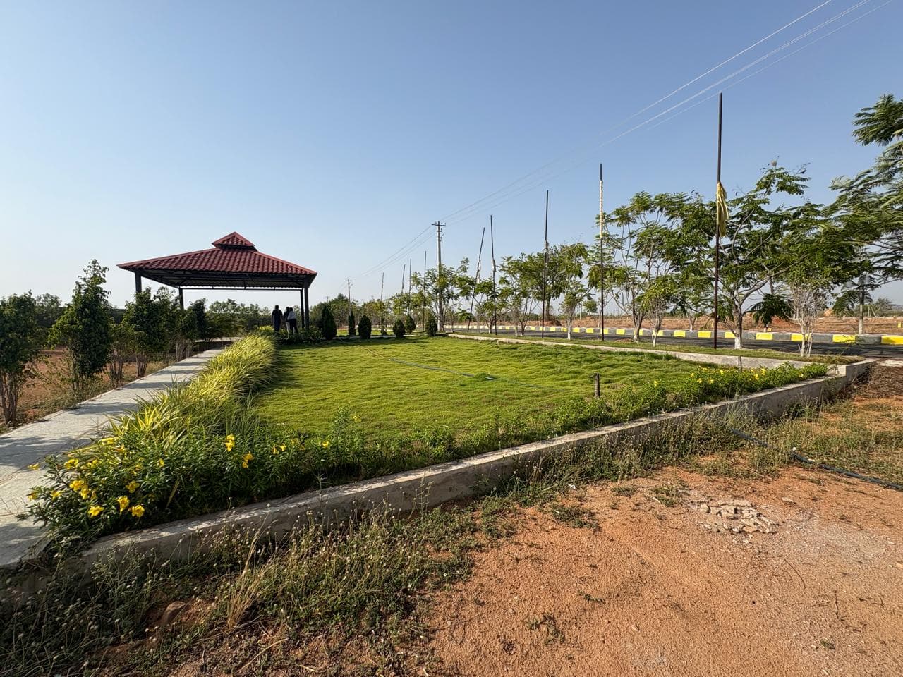 S.V.KANAKA MAPLE HOMES open plot layout in Warangal Highway — site photo 1